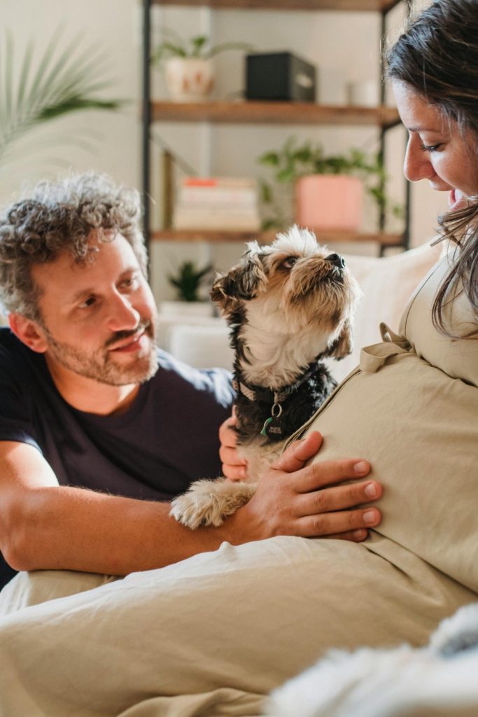 Couple with dog cuddling