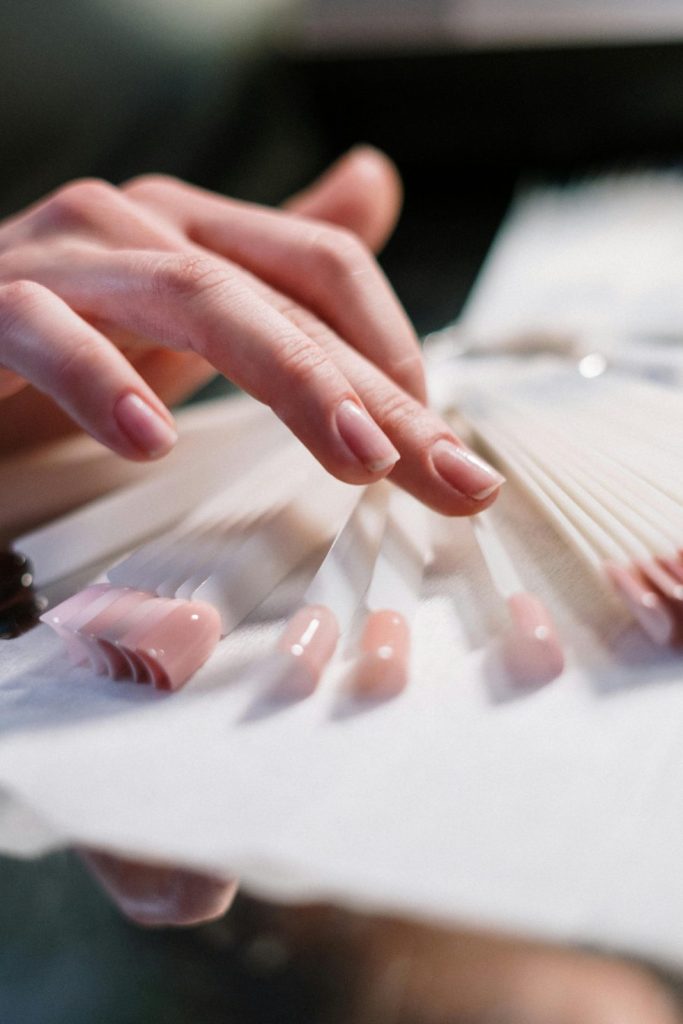 Hand choosing nail color