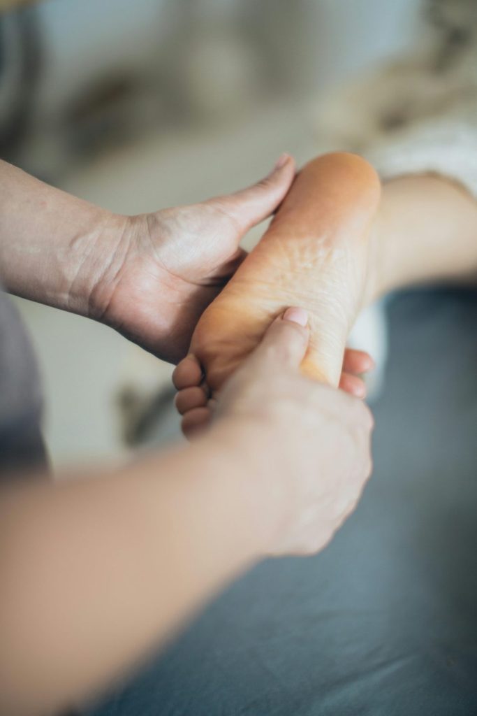 Person massaging a foot
