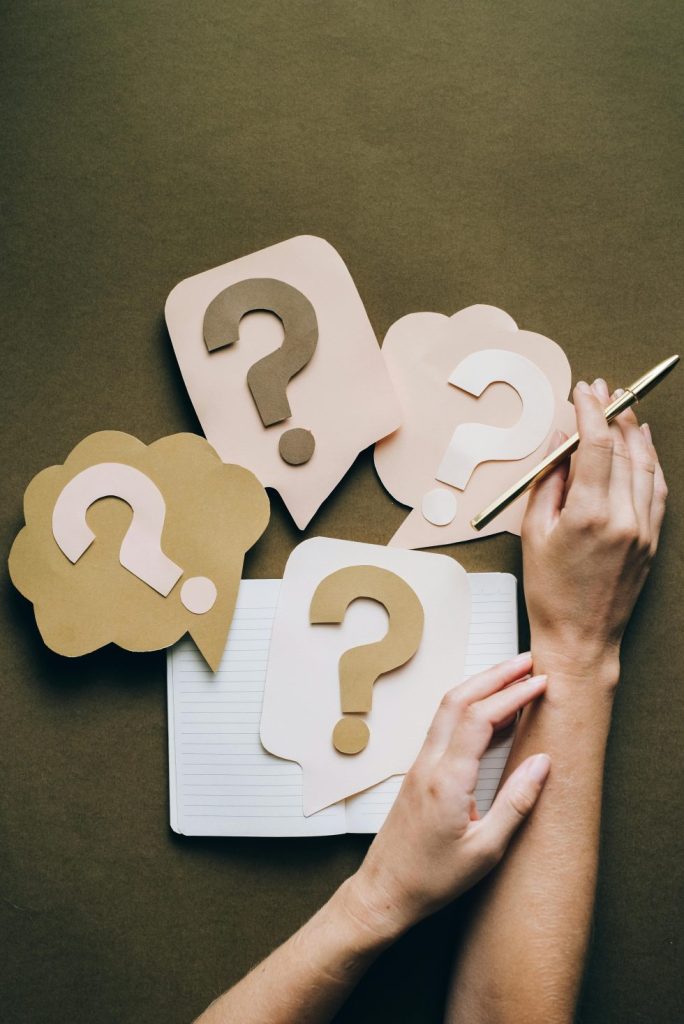 Question marks and notebook