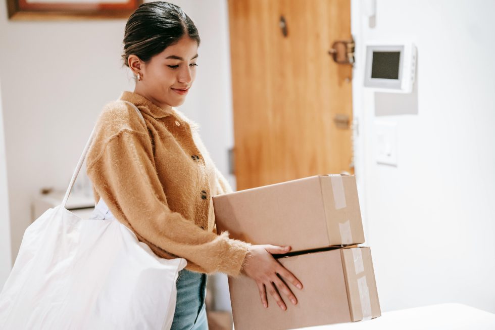 Woman carrying boxes