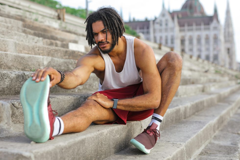 Man stretching stairs
